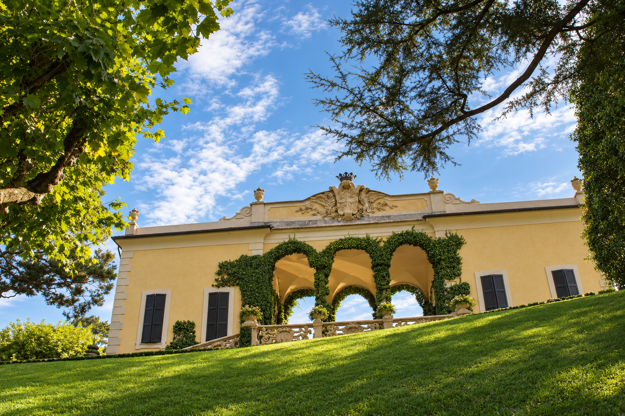 Villa del Balbianello framed by ivy-covered arches