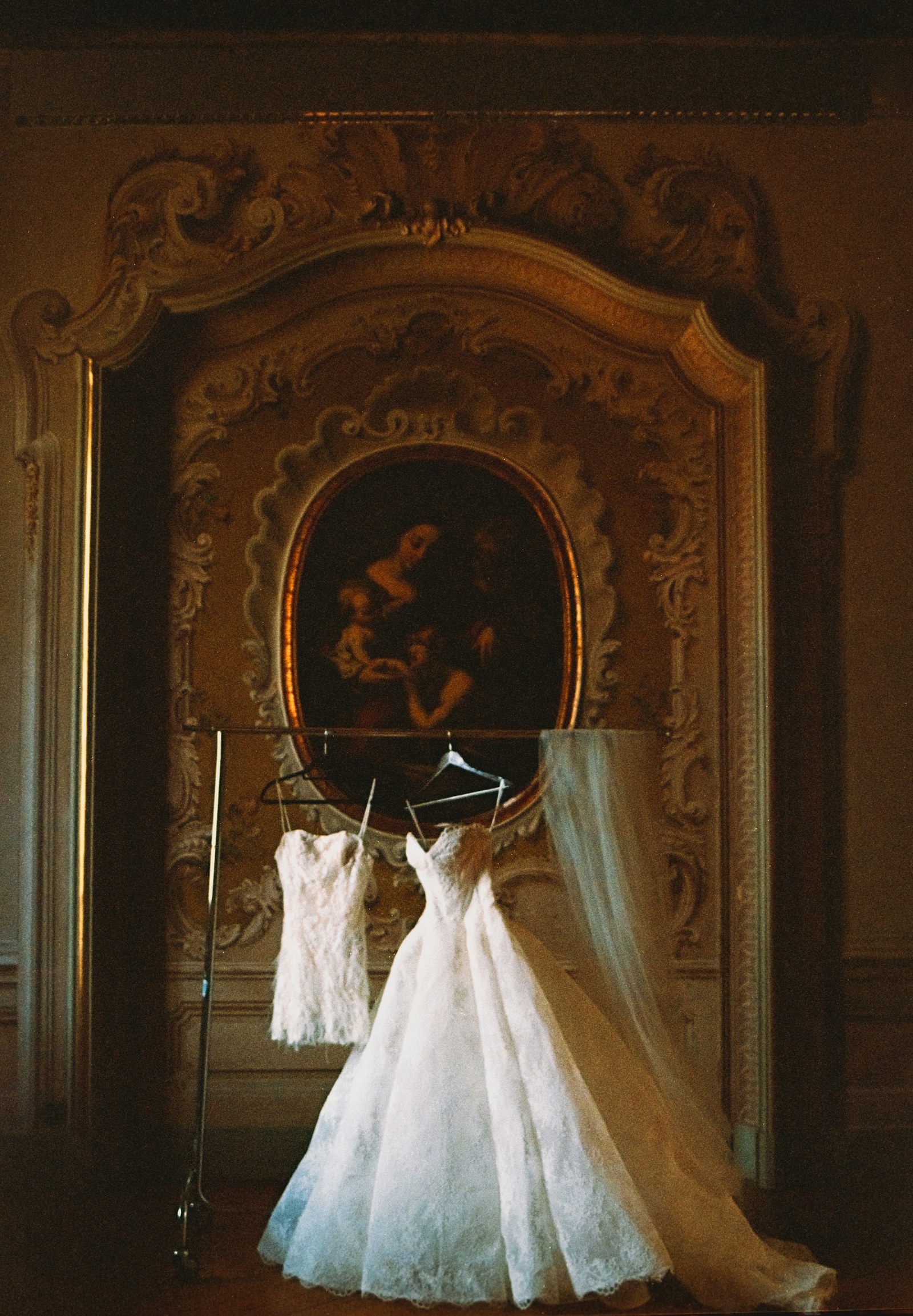Dresses displayed in a historic interior at Villa Erba