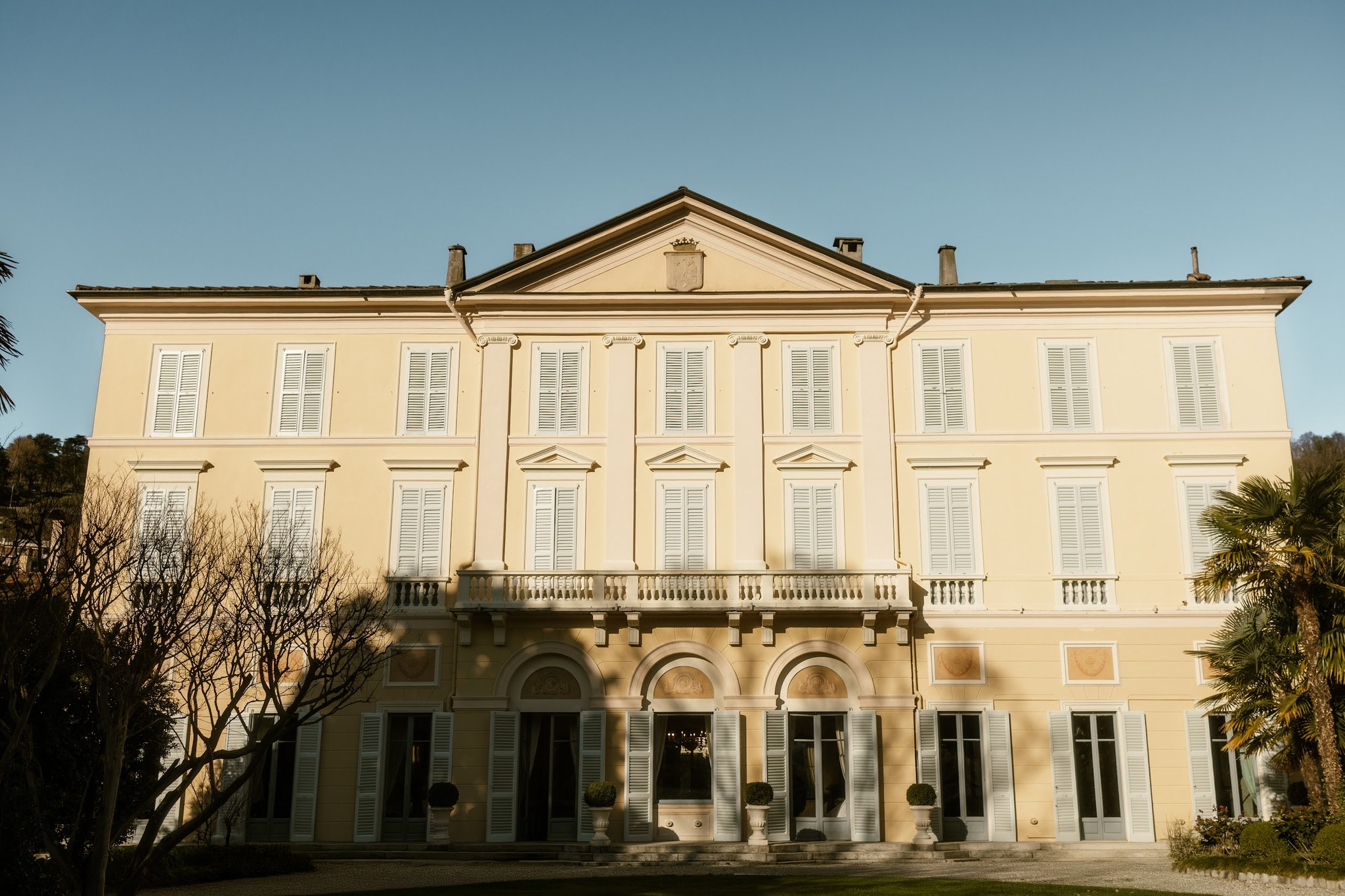 Front facade and arched entrance of Villa Revel Parravicini